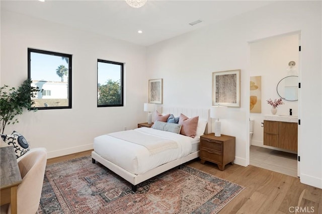 bedroom featuring light hardwood / wood-style floors