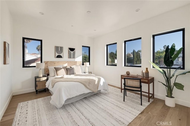 bedroom with light hardwood / wood-style flooring