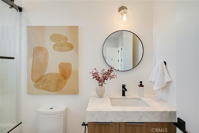 bathroom with vanity and toilet