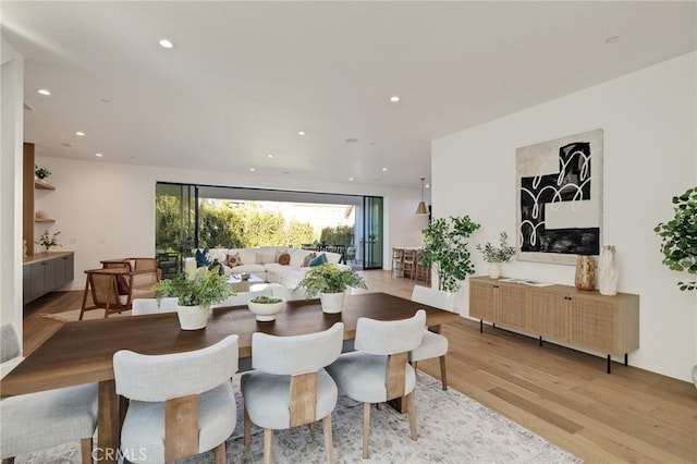 dining room with light hardwood / wood-style flooring