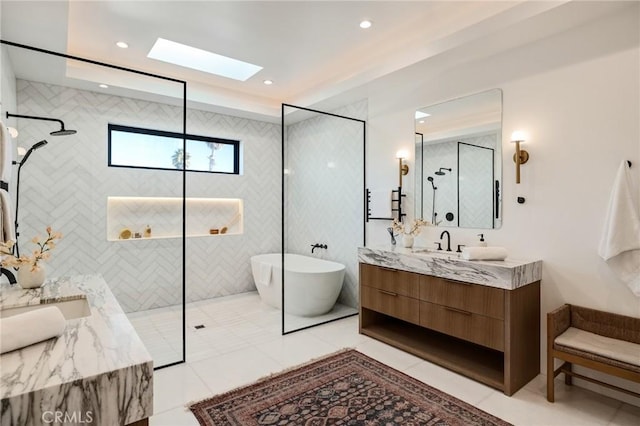 bathroom featuring plus walk in shower, tile patterned flooring, and vanity