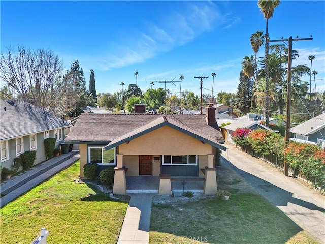 view of front of home with a front yard