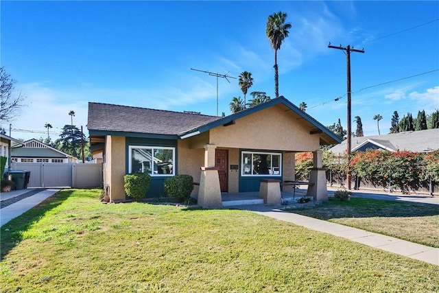 bungalow-style home with a front lawn