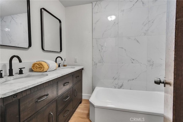 bathroom with vanity and hardwood / wood-style flooring