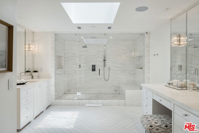 bathroom featuring parquet flooring, vanity, a skylight, and a shower with door