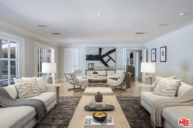 living room featuring crown molding and hardwood / wood-style floors