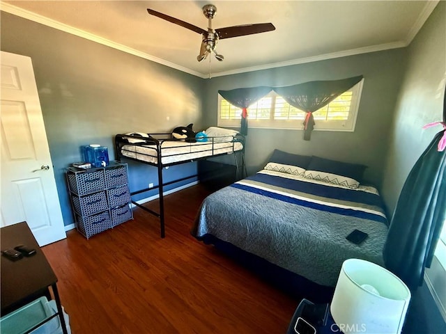 bedroom with ceiling fan, dark hardwood / wood-style flooring, and ornamental molding