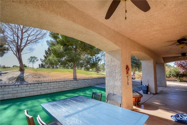 view of patio / terrace featuring ceiling fan