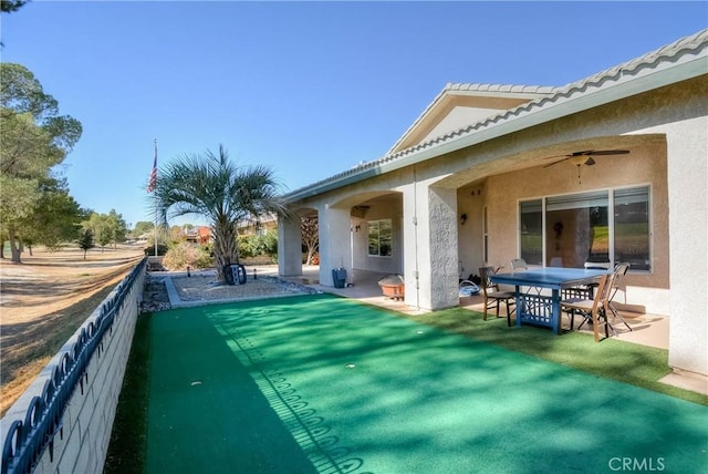 view of swimming pool featuring ceiling fan