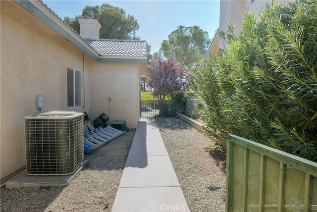 view of side of home featuring central air condition unit