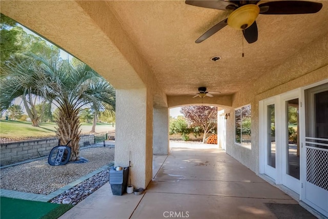 view of patio featuring ceiling fan