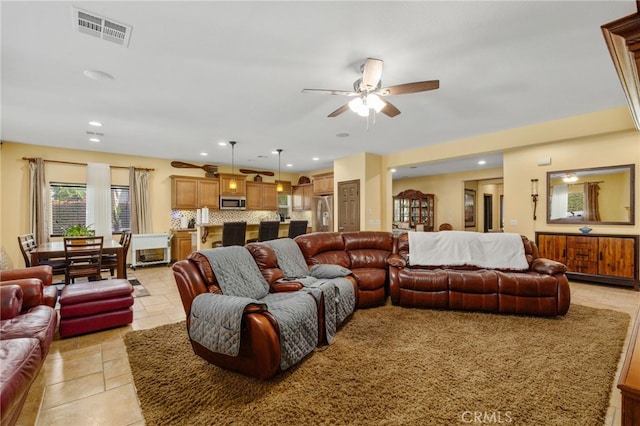 living room with ceiling fan