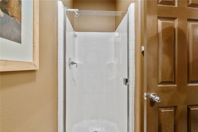 bathroom featuring an enclosed shower