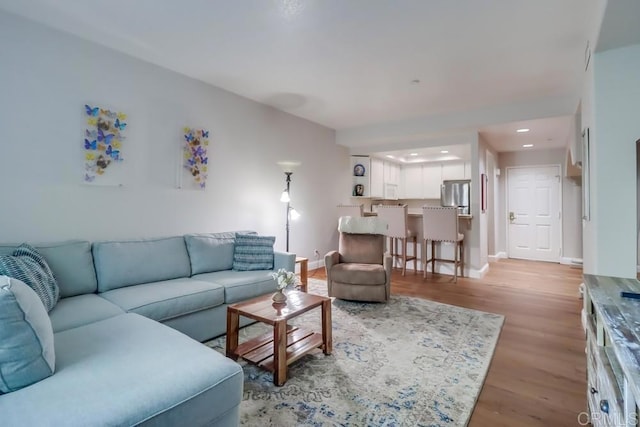 living room with light hardwood / wood-style floors