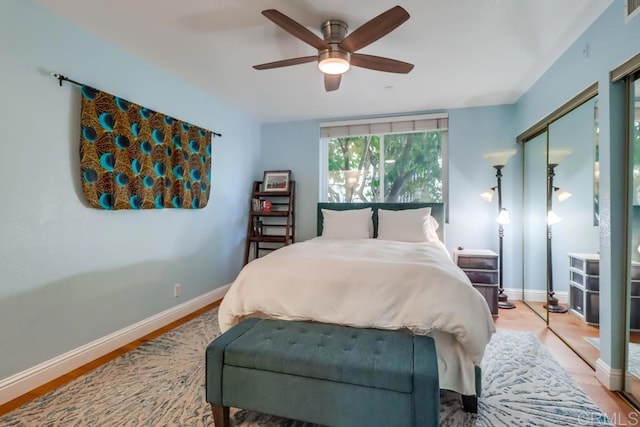 bedroom featuring ceiling fan, a closet, and light hardwood / wood-style floors