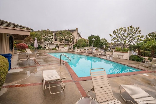 view of swimming pool featuring a patio area