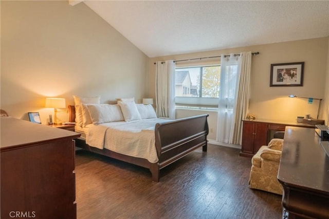 bedroom with dark hardwood / wood-style flooring and vaulted ceiling