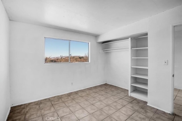 unfurnished bedroom with a closet