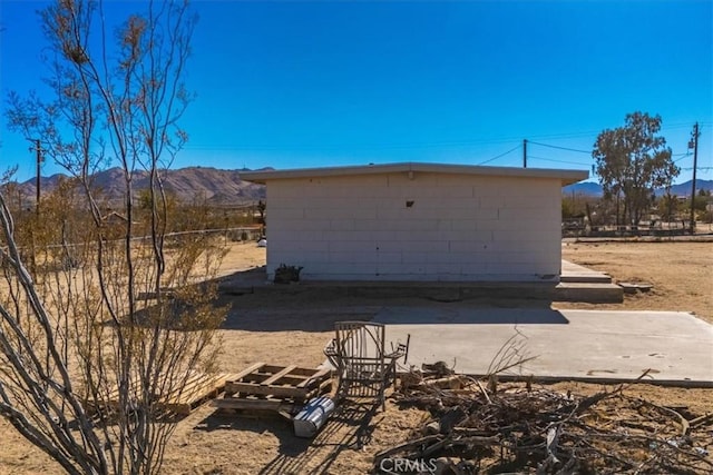 exterior space featuring a mountain view