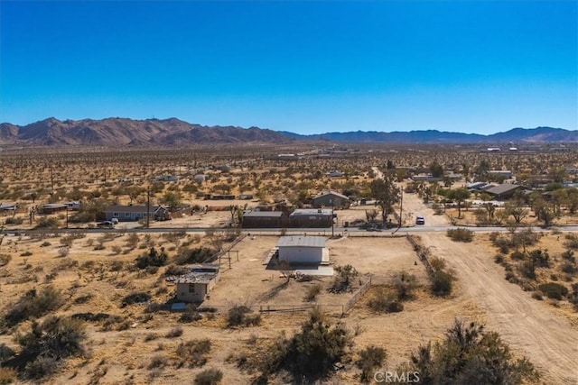 drone / aerial view featuring a mountain view