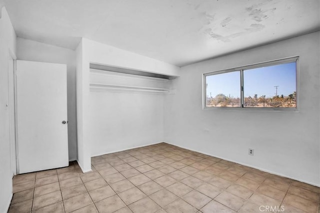 unfurnished bedroom with a closet