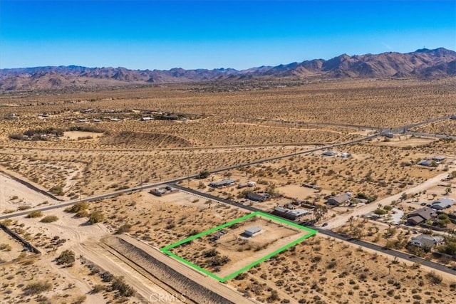 drone / aerial view featuring a mountain view