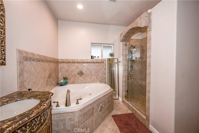 bathroom featuring tile patterned flooring, vanity, and independent shower and bath