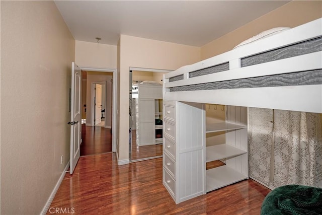 unfurnished bedroom featuring dark hardwood / wood-style flooring