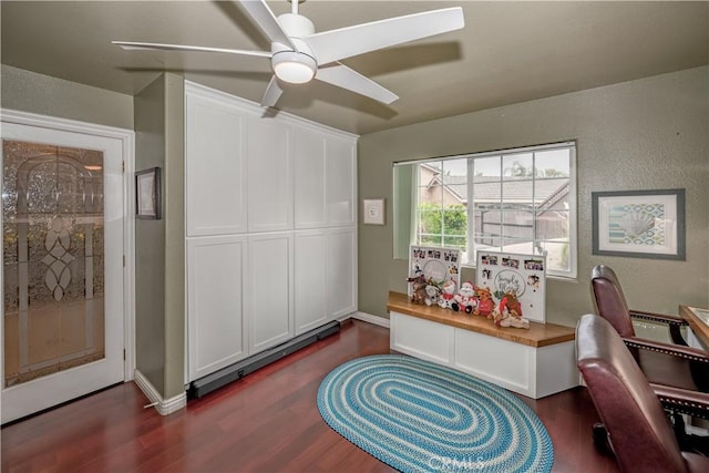 home office featuring ceiling fan and dark wood-type flooring