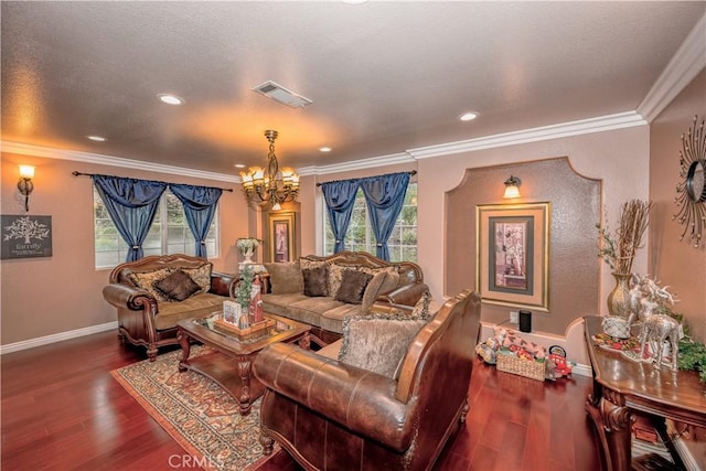 living room featuring hardwood / wood-style flooring, a notable chandelier, and ornamental molding