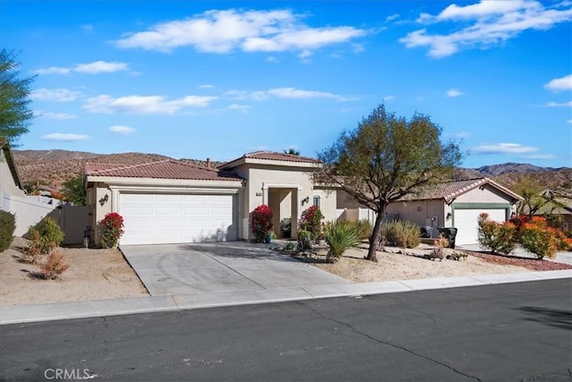 view of front of home featuring a mountain view and a garage