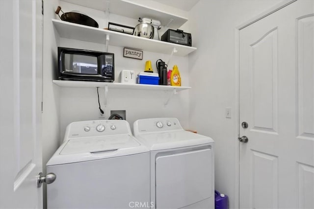 laundry room with independent washer and dryer