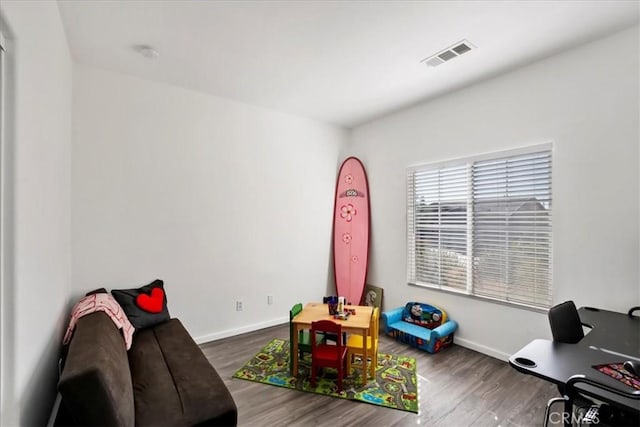 recreation room featuring dark wood-type flooring