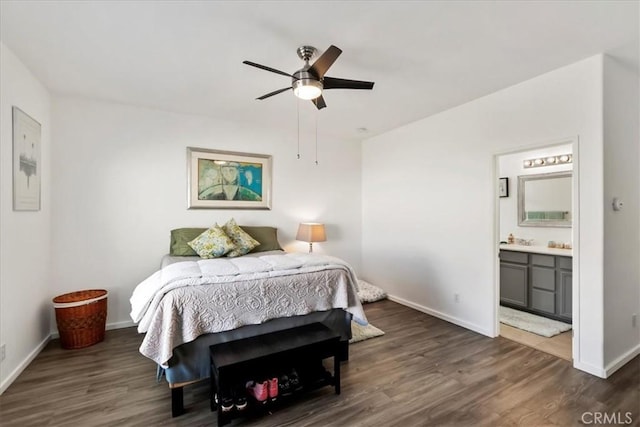 bedroom featuring ceiling fan, ensuite bathroom, and dark hardwood / wood-style floors