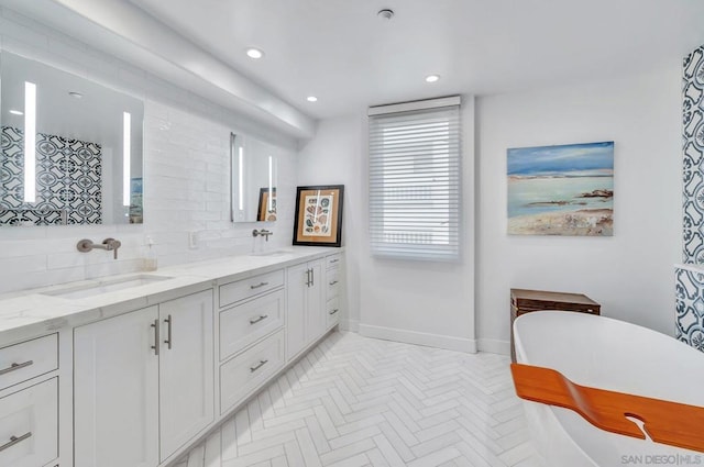 bathroom with decorative backsplash and vanity