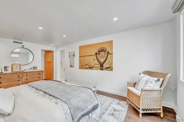 bedroom with hardwood / wood-style flooring