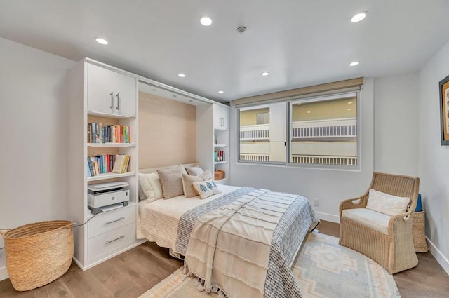 bedroom featuring hardwood / wood-style flooring