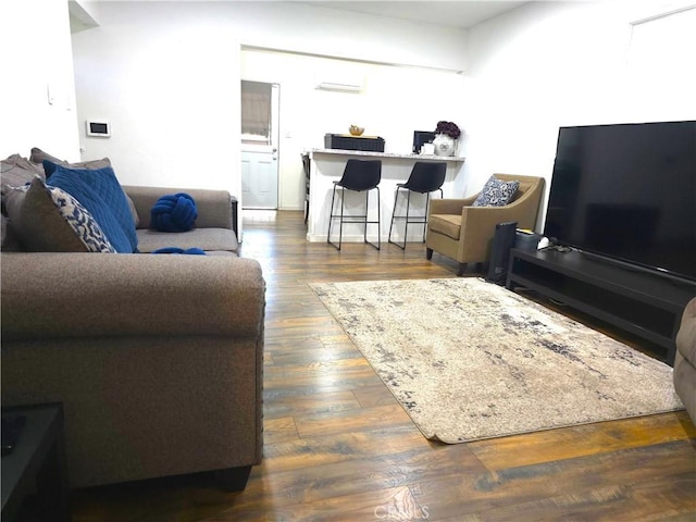 living room with dark hardwood / wood-style floors and a wall mounted AC