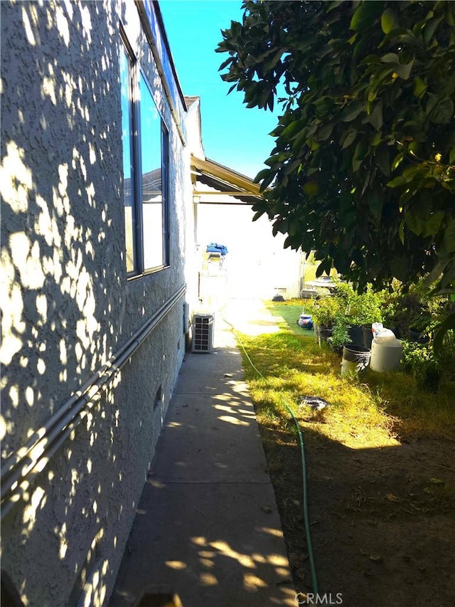 view of home's exterior with cooling unit