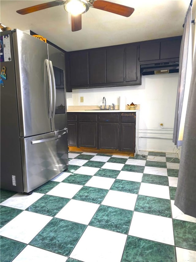 kitchen featuring stainless steel fridge and sink