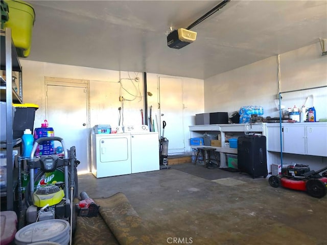 garage featuring washer and dryer and a garage door opener