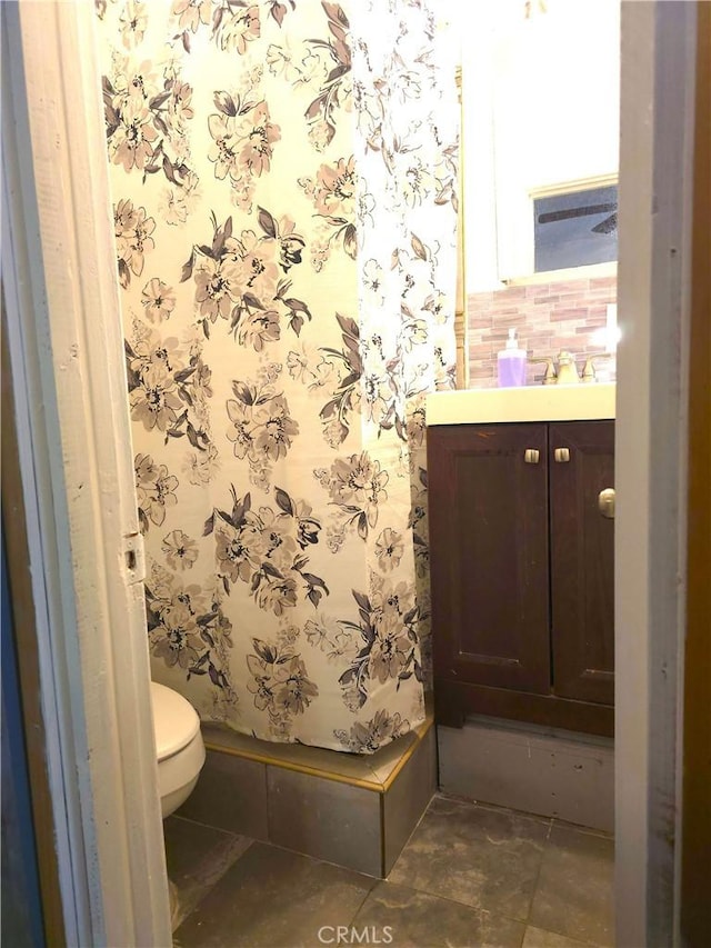 bathroom with vanity and toilet