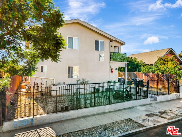 view of home's exterior featuring a balcony