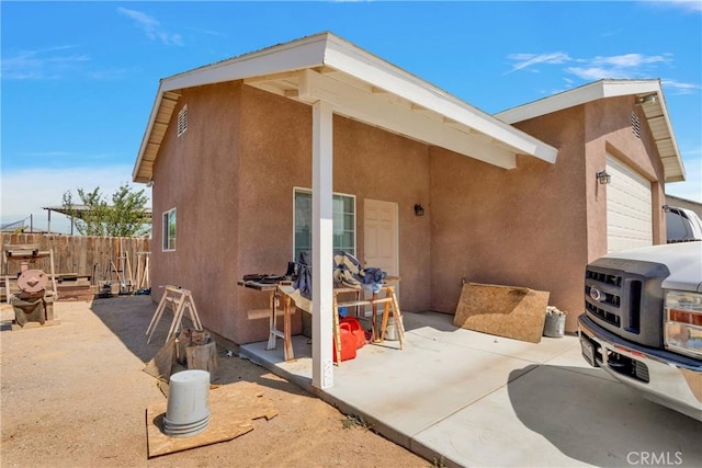 back of house with a garage