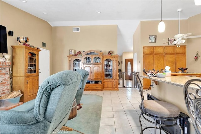 living room with high vaulted ceiling, ceiling fan, and light tile patterned flooring