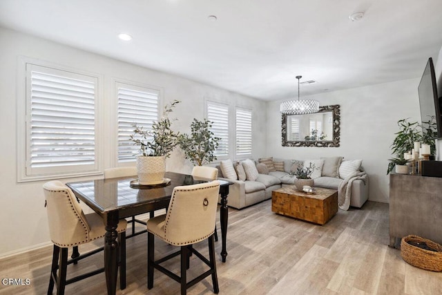 dining room with light hardwood / wood-style flooring