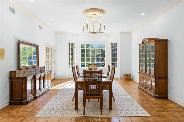 dining room featuring a wealth of natural light, light tile patterned floors, and a chandelier