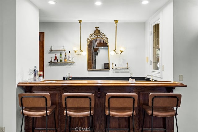 bar with decorative light fixtures