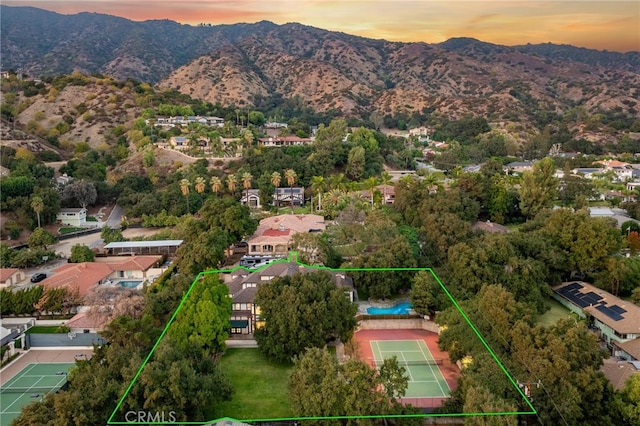 aerial view at dusk with a mountain view