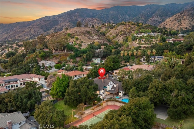 aerial view at dusk with a mountain view